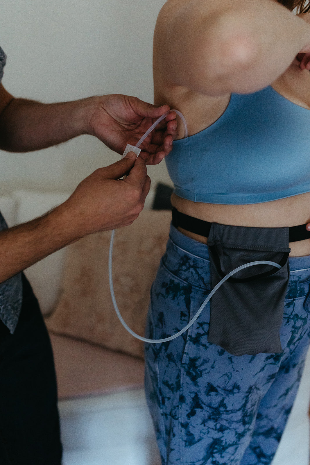 Cleaning drain lines with an alcohol swab.