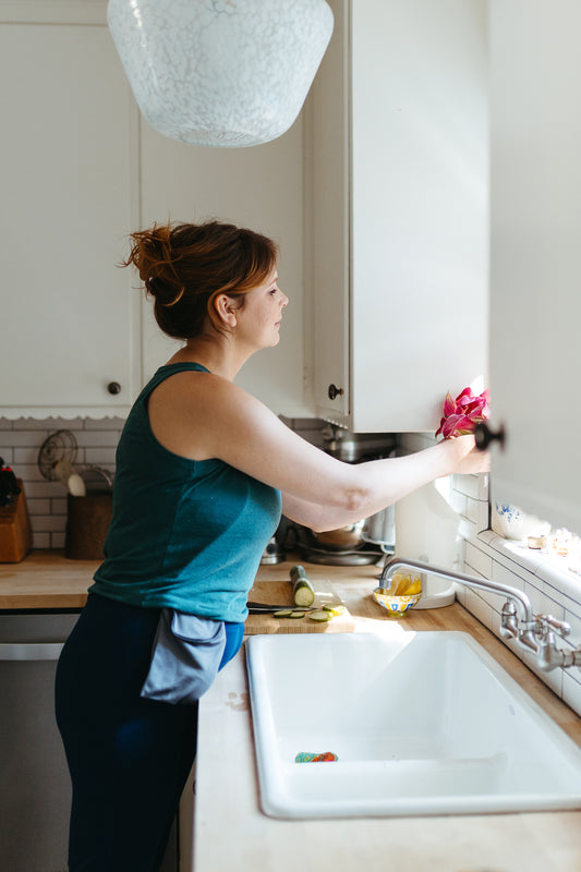 A woman recovering from bilateral mastectomy slowly begins to resume arm mobility