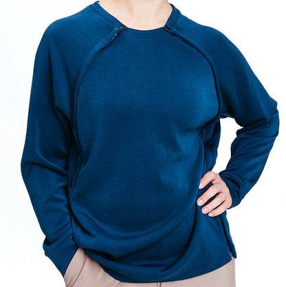 Blue long-sleeve Recovery Crew worn by a person on a white background